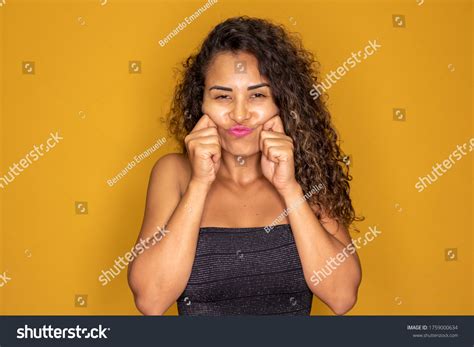 Young Afro Woman Pinching Cheeks Stock Photo 1759000634 Shutterstock