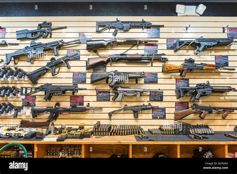 A Large Variety Of Guns Rifles And Weapons At A Gun Store Stock Photo