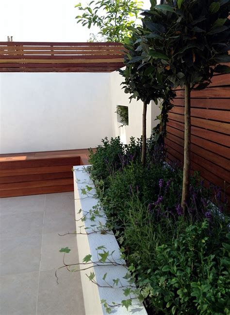 Low maintenance garden design defines a modern outdoor lifestyle which sustains unfussy minimal upkeep in our london town gardens, small patios and city courtyards with effortless manageability all year round across varying landscape design scales, environmental contexts and diverse uses. Small garden design London Clapham Balham ideas low ...
