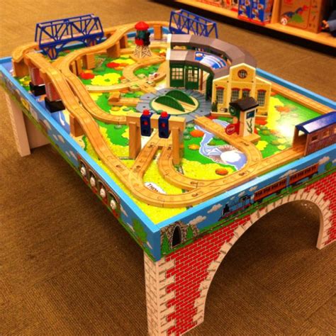Thomas the train village with tracks, tunnels, other engines, 44 freight cars, water tower, train station, saw mill, clock tower, filling station and more (over 100 pieces) plus display table with drawers underneath. Pin on Ooo, I want!
