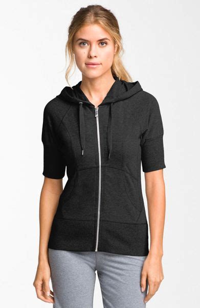 Get souped up extras with sweatshirts and hoodies that have zip pockets for storage and rib knit side panels for easy movement. Zella Supersoft Short Sleeve Hoodie in Black | Lyst