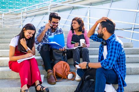 Group Of Young Female And Male College Students On Campus Stock Photo