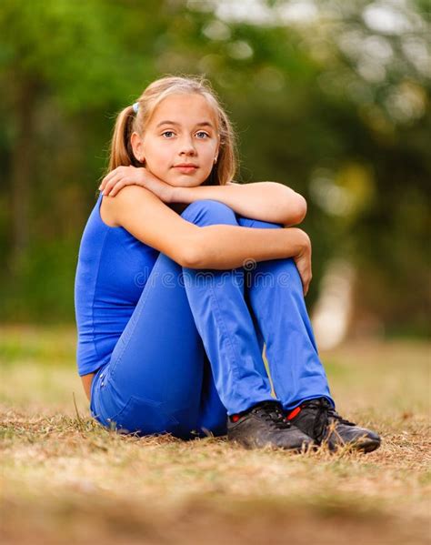 Teenage Girl Sitting On Green Stock Image Image Of Blond Female