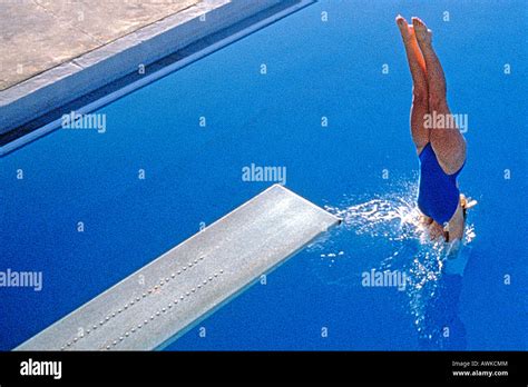 Women Diving Into The Pool Stock Photo Alamy