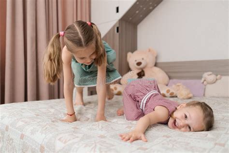 cute girls play on the bed in the room stock image image of comfort