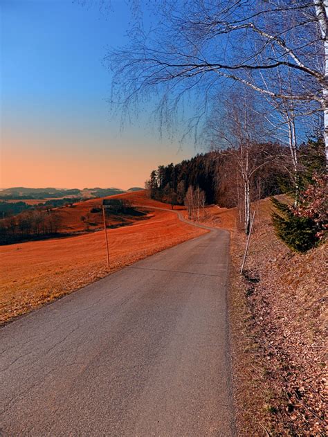 Country Road Into A Beautiful Sunset At Auberg Landscape