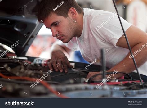 Car Repair Mechanic Fixing Auto Man Working On Car In Garage At Home