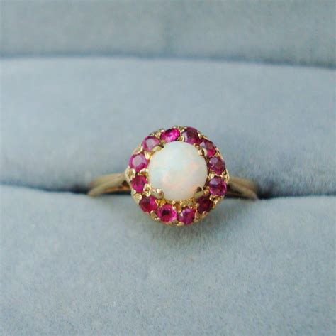 A 9ct Yellow Gold Opal And Ruby Ring Jewellery And Gold Hemswell