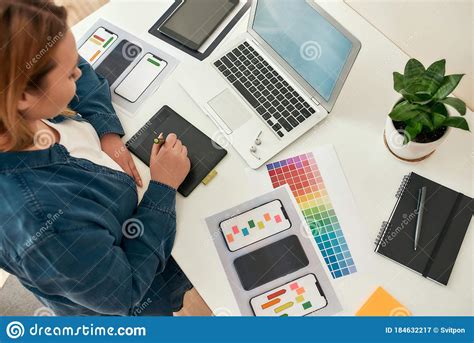 Top View Of Young Creative Female Ux Ui Designer Drawing On Graphic