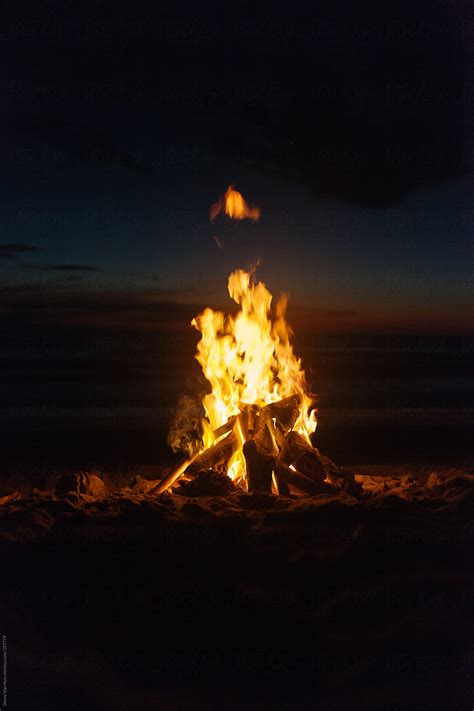 Campfire On The Beach At Night By Stocksy Contributor Denni Van