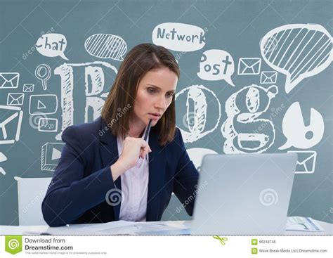 Thoughtful Business Woman At A Desk Looking At A Computer