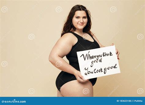 Plus Size Model Beautiful Fat Woman Portrait Brunette Holding Motivational Poster Stock Photo