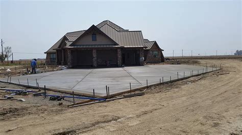 Blue rock's commitment to sustainability. Gray Broom Finish Concrete Driveway | Blue Rock Concrete