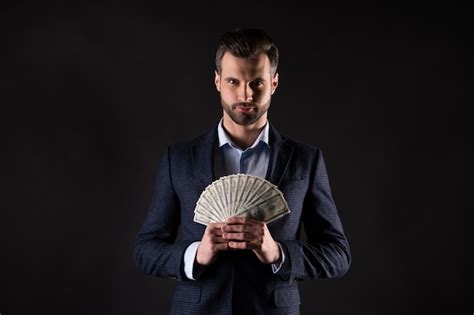 Premium Photo Photo Of Handsome Business Guy Hold Hands Usa Bucks Rich Success Millionaire