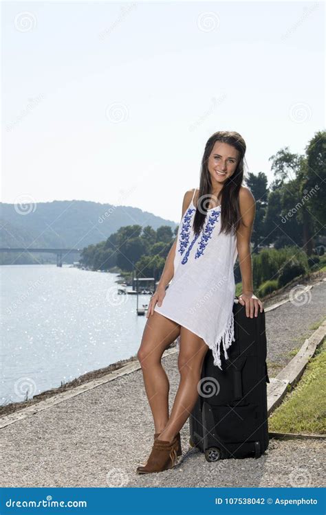 Stunning Young Brunette Woman Poses Outside In White Sundress Stock