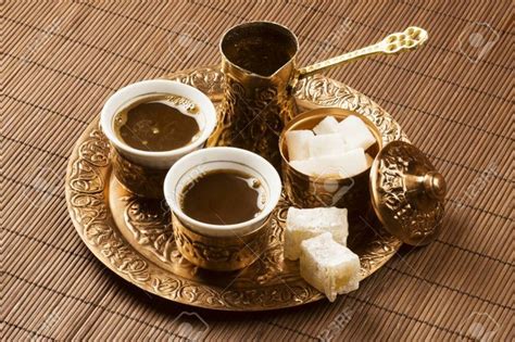 Golden Turkish Coffee Set With Two Coffee Cups On Brown Table Stock