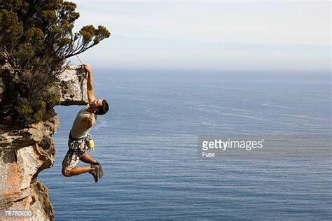 Person Hanging Off Cliff Photos And Premium High Res Pictures Getty