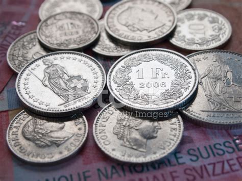 Shining Swiss Franc Coins On 20 Swiss Franc Bank Notes Stock Photo