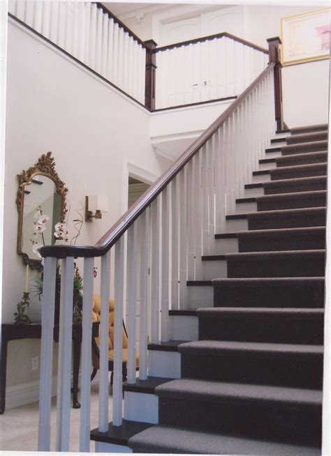 Painted Staircase With White Oak Pickets And Dark Stained Railings