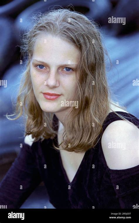 Young Slim Pretty Blonde Haired Woman In Her Early 20s Sitting For