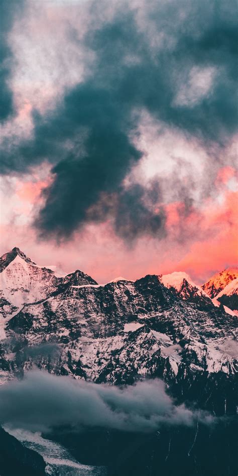 Download 1080x2160 Wallpaper Clouds Sunset Glowing Peaks Mountains