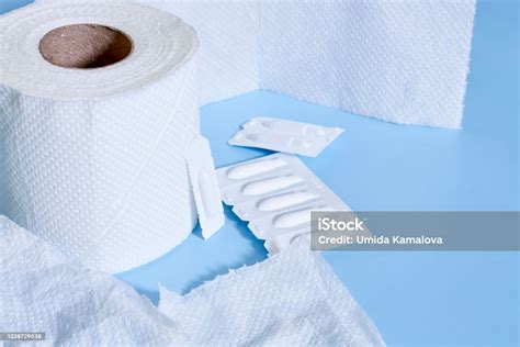 Toilet Paper Roll And Hemorrhoidal Suppositories Stock Photo Download