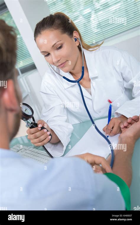 Doctor Taking Patients Blood Pressure Stock Photo Alamy