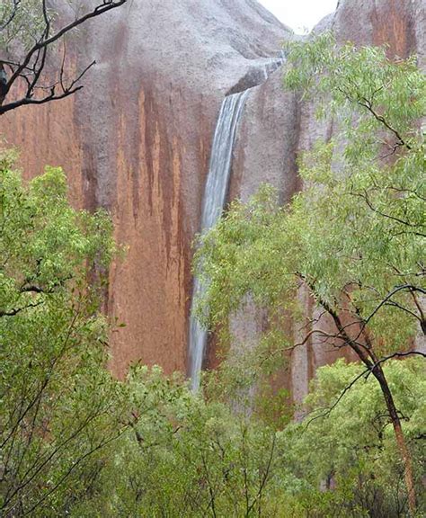 Unseasonable Rain Causes Waterfalls Over Australias Famed Uluru Ayers Rock Abc13 Houston