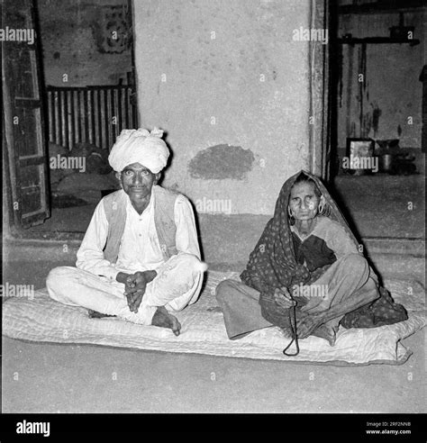Old Vintage 1900s Black And White Picture Of Indian Couple Portrait Man Woman Sitting Husband