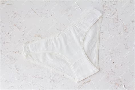 Premium Photo White Cotton Panties On The White Structured Background