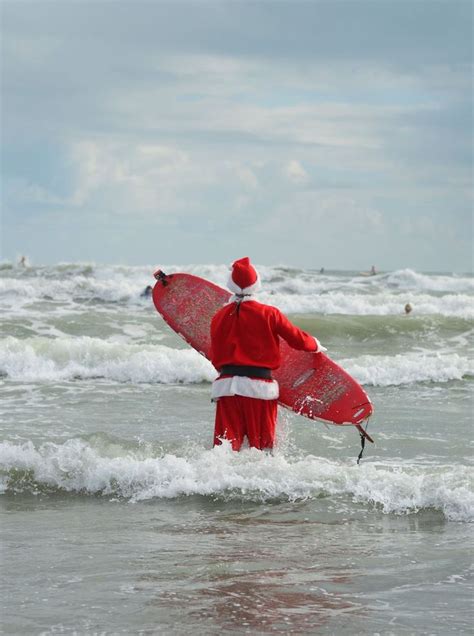 surfing santas in cocoa beach florida where the crowd might be more colorful than santa