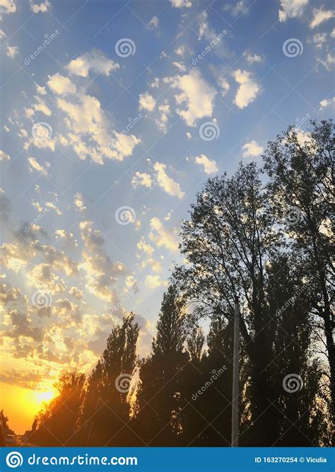 Sunset Cloudy Sky With Picturesque Clouds Lit By Warm Sunset Sunlight