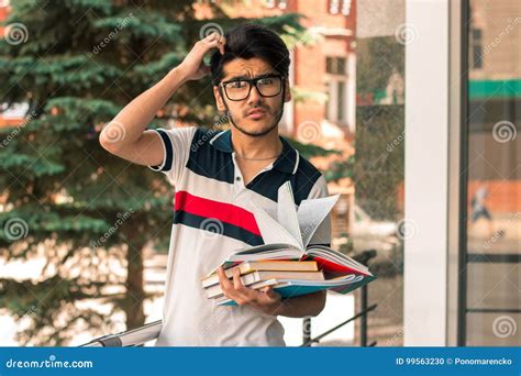 Portrait Of A Brooding Guy With Books Stock Photo Image Of Male
