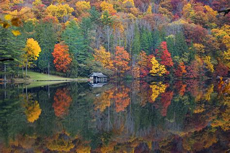 Lake Logan Boathouse In Fall Photograph By Mike Mcglothlen
