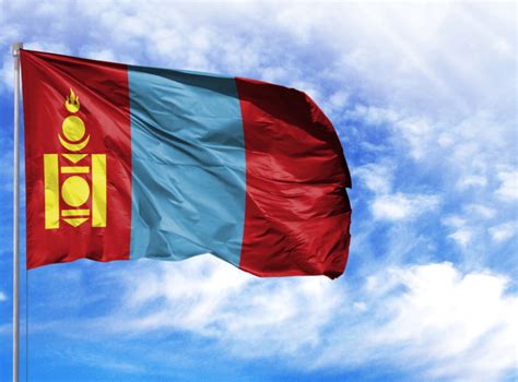 National Flag Of Mongolia On A Flagpole In Front Of Blue Sky