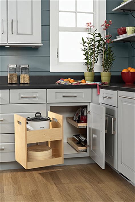 An inexpensive solution to using optimal storage in the corner kitchen cabinet is alternating shelves. Blind Corner Storage - Kitchen Drawer Organizers ...