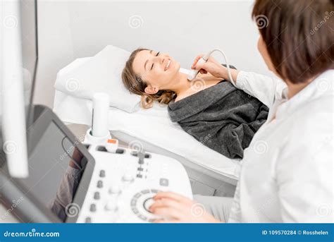 Doctor Making Ultrasound Examination To A Young Woman Stock Photo