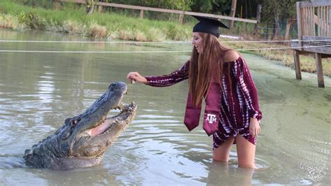 Texas Aandm University Student Poses With Alligator In Graduation Photos