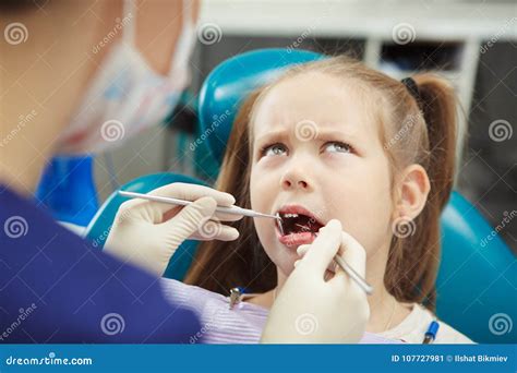 Young Patient Sits At Dentist Chair And Feels Pain Stock Image Image