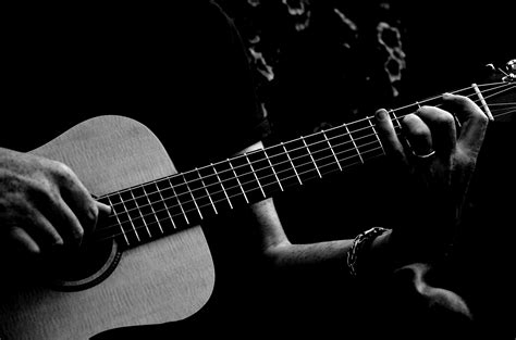 Monochrome Photo Of Person Playing Acoustic Guitar · Free Stock Photo