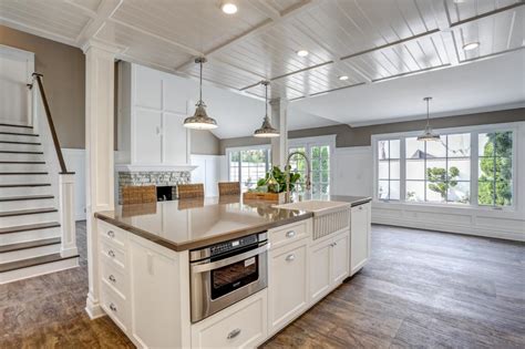 All flooring design, frisco, colorado. Airy White Kitchen With Rustic Hardwood Floors | HGTV
