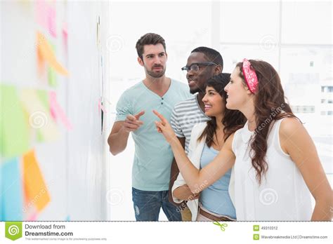 Cheerful Coworkers Standing And Speaking Together Stock Photo Image
