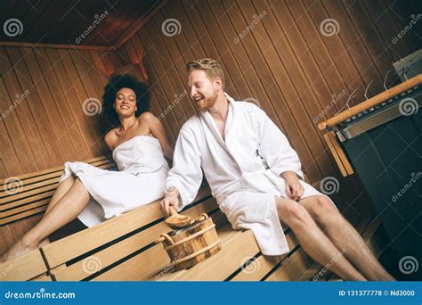 Young Happy Couple Relaxing Inside A Sauna At Spa Resort Hotel Luxury