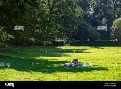 Summers Day Relaxing On The Grass Sunbathing Stock Photo Alamy