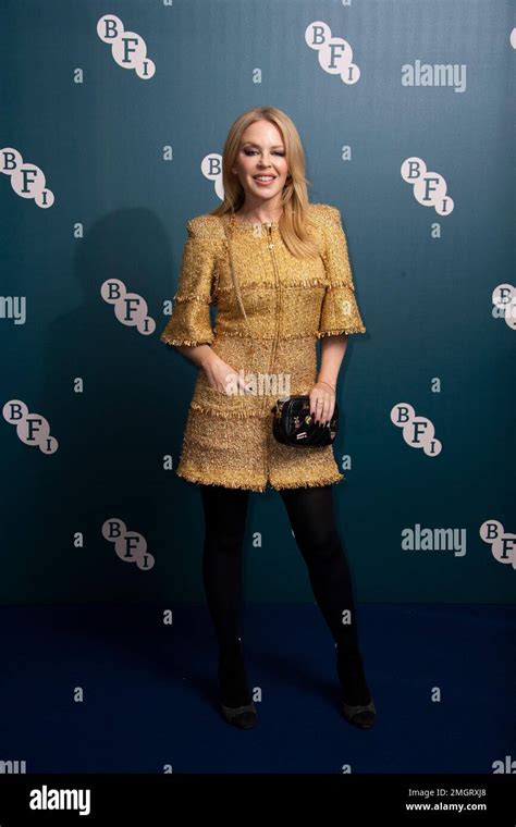 Singer Kylie Minogue Poses For Photographers Upon Arrival At The BFI Fellowship Reception For