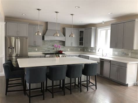 Maybe you would like to learn more about one of these? Gray kitchen cabinets with white quartz island and ...