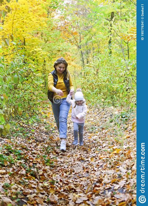 Mother And Daughter Play In Autumn Park Stock Image Image Of Nature