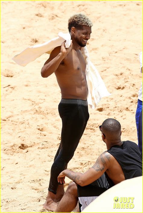 Usher Stays Clothed While Paddle Boarding Goes Shirtless On The Beach Photo