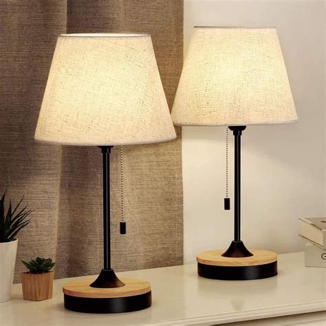 Check spelling or type a new query. A set of two wooden desk lamps featuring neutral lamp ...