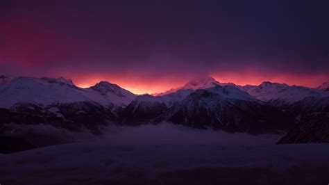 Snow Covered Mountains Peaks Fog Under Purple Black Cloudy Sky 4k Hd
